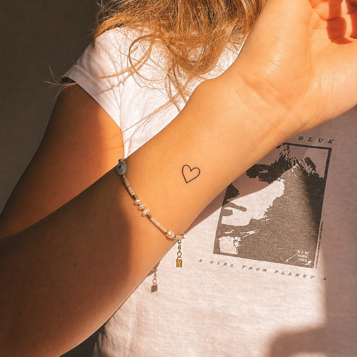 Small heart temporary tattoo on wrist